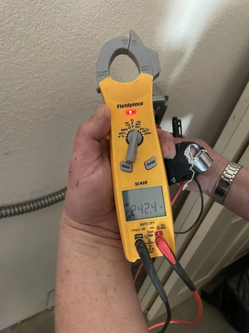 Voltage testing with clamp meter during Whole House Surge Protector in Montevallo
